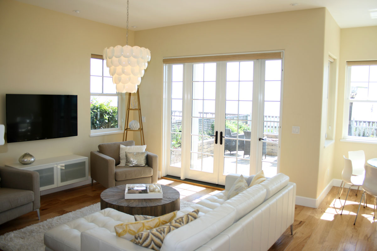 TrueStyle & Design Capitola home living room with french doors